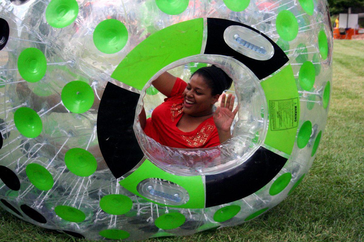 Senior Kimberely Burley tries her luck at a zorbing race during the VolAware Street Fair on Wednesday, Oct. 2.