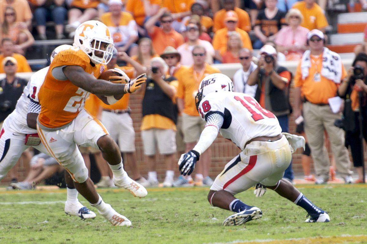 Senior running back Rajion Neal jukes out of an attempted tackle by South Alabama safety Terrell Brigham during UT's 31-24 win over the Jaguars at Neyland Stadium on Saturday, Sept. 28. Neal rushed for a career-high 168 yards against the Jags.