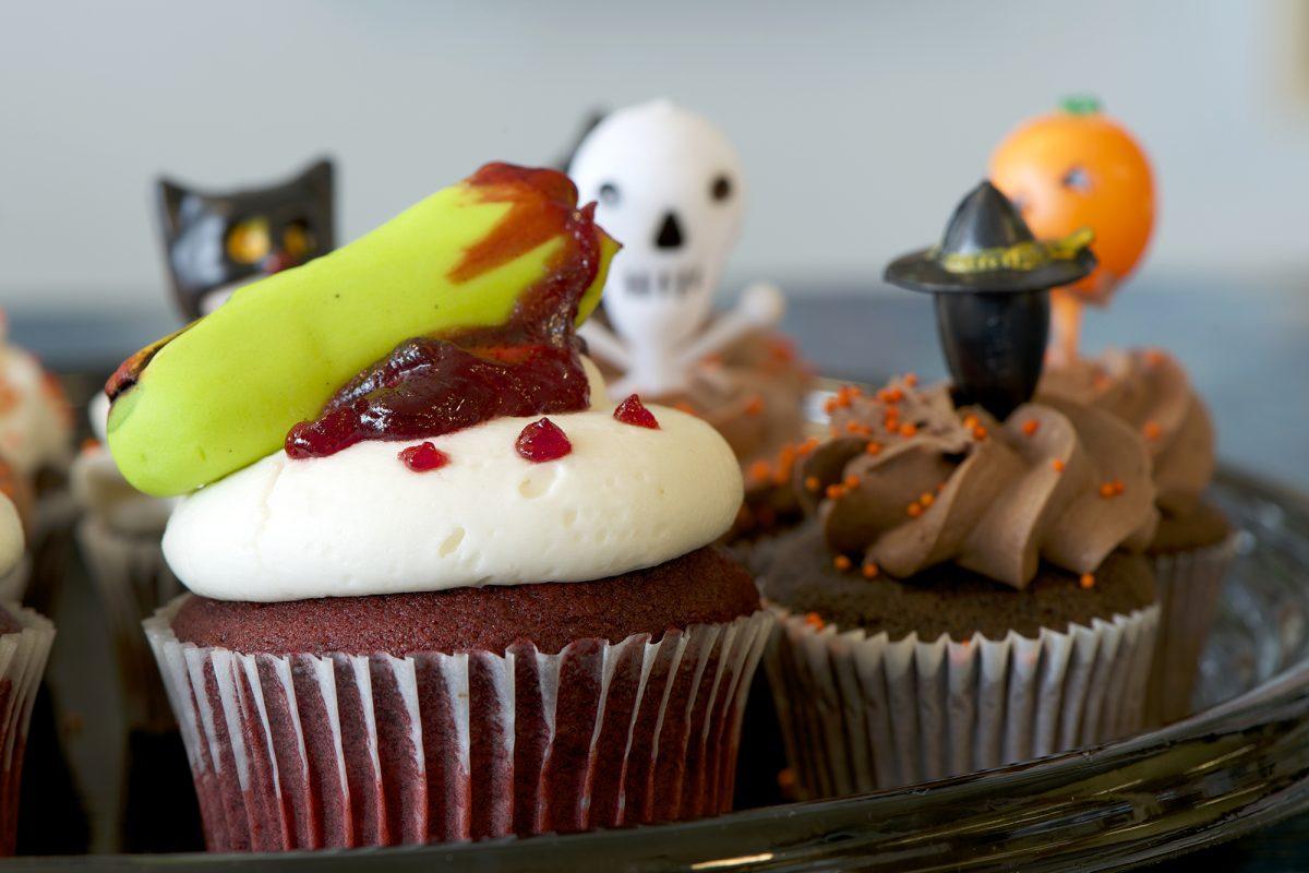 Magpie's cupcakes are adorned with a witch's hat and assorted festive holiday icons in lieu of the Halloween season.
