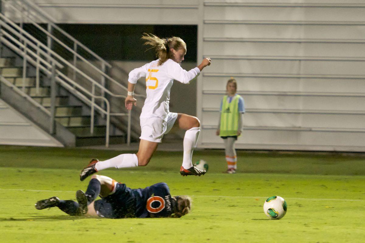 Caroline Brown jumps over an Auburn defender during the Lady Vols soccer match at Regal Soccer Stadium on Oct. 18. The match ended in a 1-1 tie.