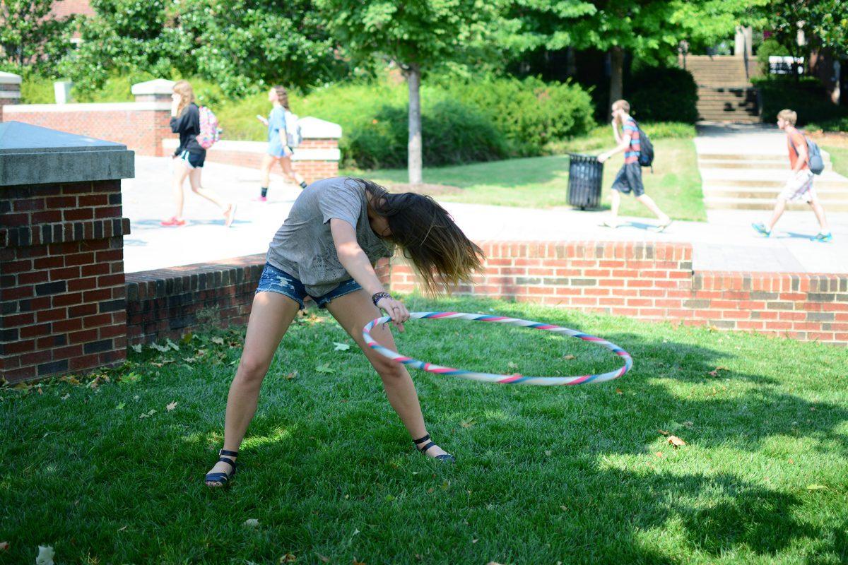 Hannah Baker, senior in arts, hula hoops outside of Humanities Amphitheatre during her downtime on Sept. 12.