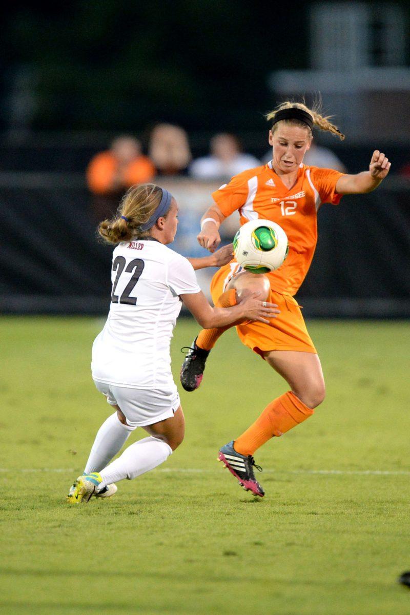 Tennessee midfielder Michele Christy controls the ball with a knee juggle against Jennifer Miller of Ole Miss Rebels at Regal Soccer Stadium on Oct. 4.