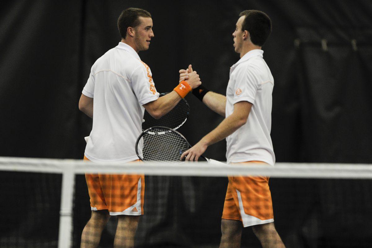 Brandon Fickey, left, and Jarryd Chaplin congratulate one another during a tennis match against the Vanderbilt Commodores on March 24.