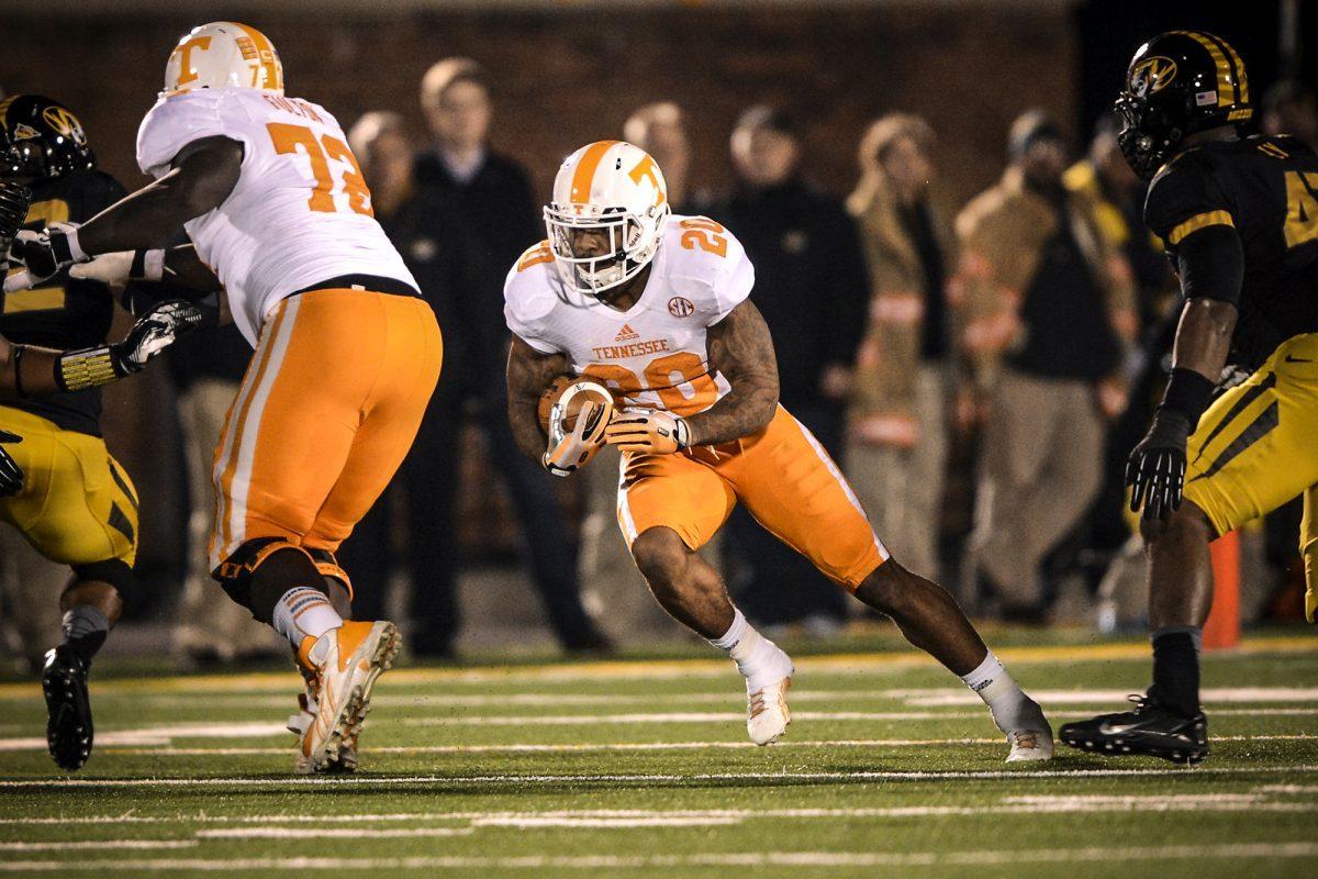 Running back Rajion Neal plunges through a hole during the SEC matchup between the Tennessee Volunteers and the Missouri Tigers in Columbia, Missouri on Nov. 2.