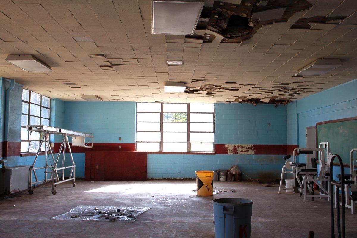 Ceiling tiles and a window pane missing from the weight room exemplify the current state of Knoxville College's campus.