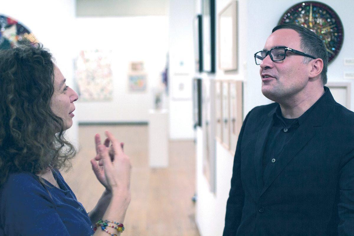 New York artist Pavel Zoubok, left, speaks about the art of collage at UT's Ewing Gallery of Art and Architecture on Monday.