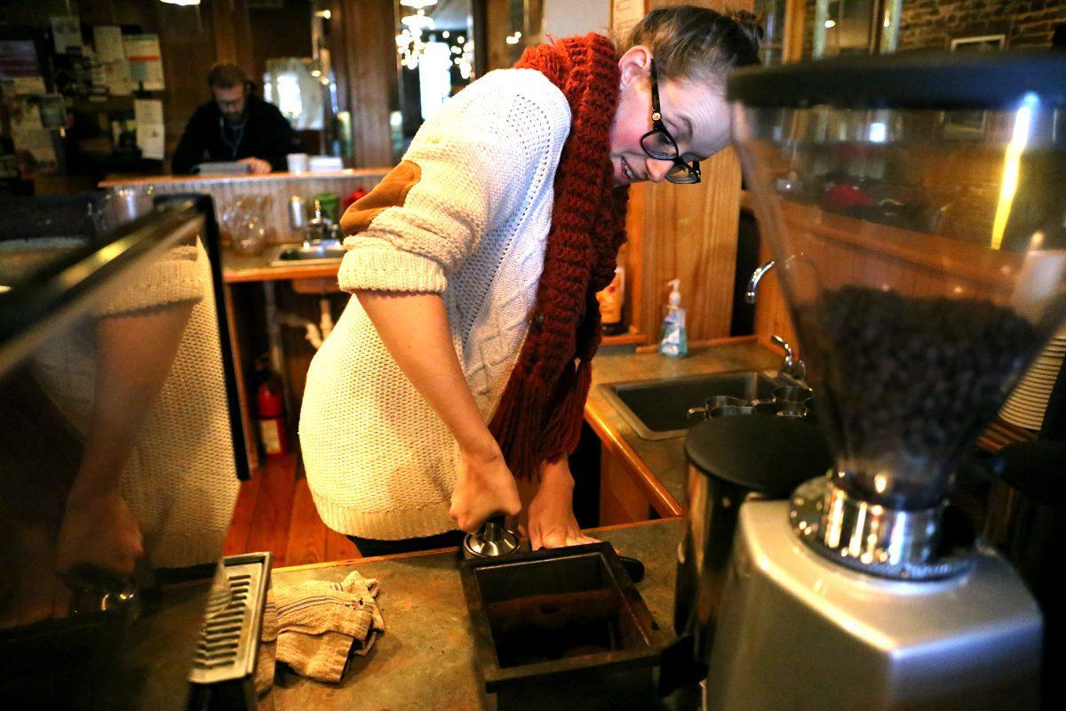 Allie Sampson prepares a latte at Remedy Coffee on Wednesday. Owned by a church, Remedy strives to keep its doors open to all customers and make bonds with the community.