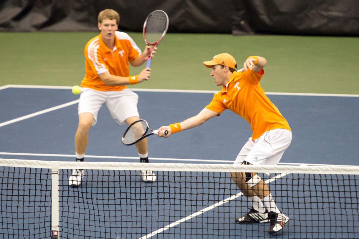 Junior Hunter Reese, right, forehands the ball during a semifinals doubles match with his partner, Mikelis Libietis, during the USTA/ITA Ohio Valley Regional Championships at Goodfriend Tennis Center in Knoxville, Tenn., on Oct. 13.