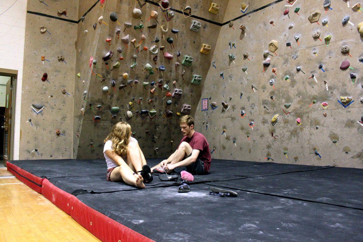 Corinne Kinzy, left, sophomore in mechanical engineering, and Josh Turan, senior in material science and engineering, practice on the 45 degree climbing wall in HPER on Aug. 23.