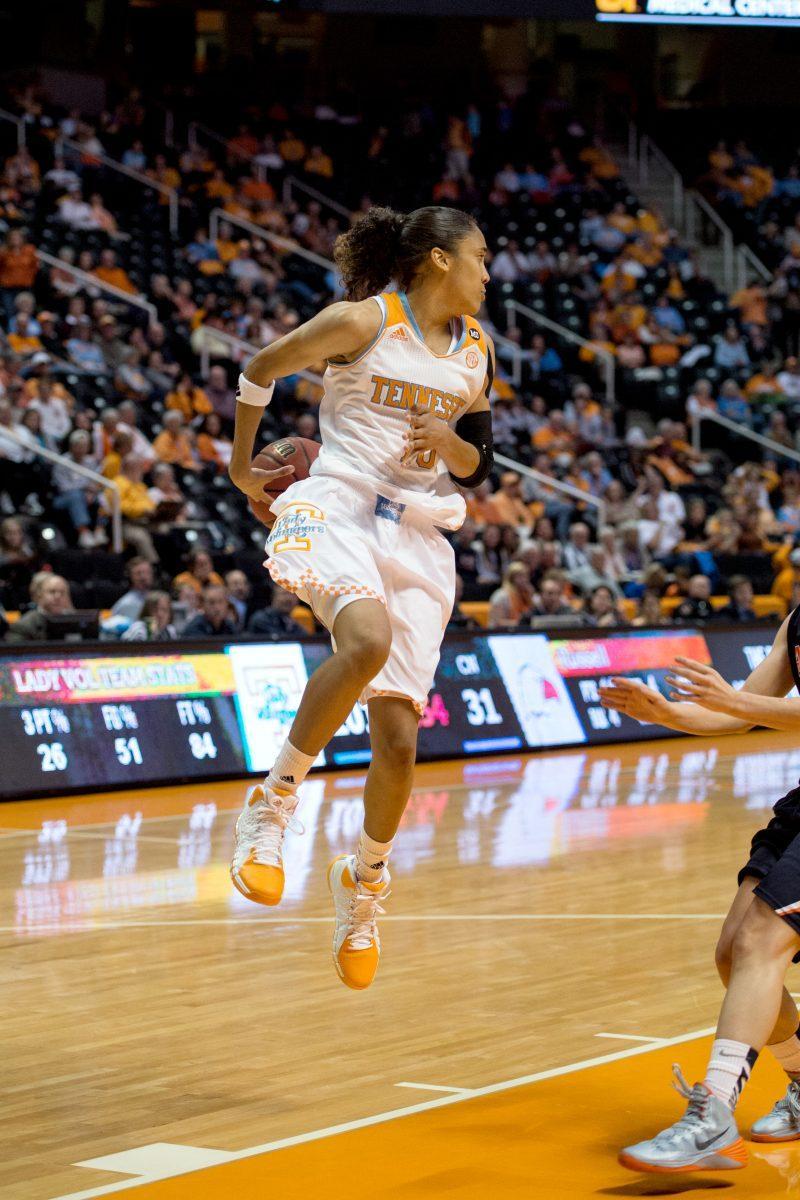 Senior guard Meighan Simmons delivers a behind the back pass during an exhibition game against Carson-Newman Lady Eagles at Thompson-Boling Arena on Monday.