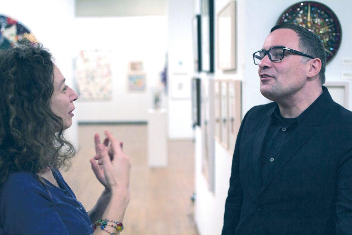 New York artist Pavel Zoubok, left, speaks about the art of collage at UT's Ewing Gallery of Art and Architecture on Monday.