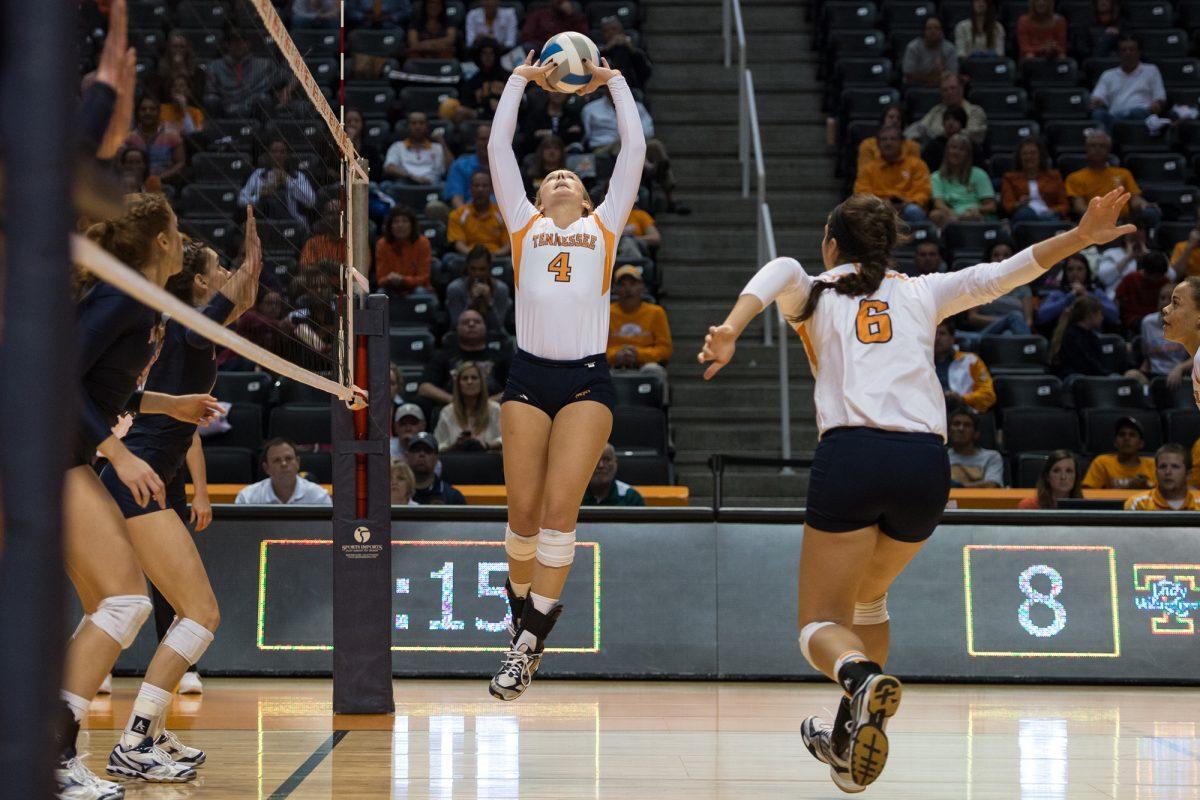 Tennessee setter Lexi Dempsey, left, sets the ball for middle blocker Shealyn Kolosky during an SEC matchup between UT and the Auburn Tigers at Thompson-Boling arena on Friday.