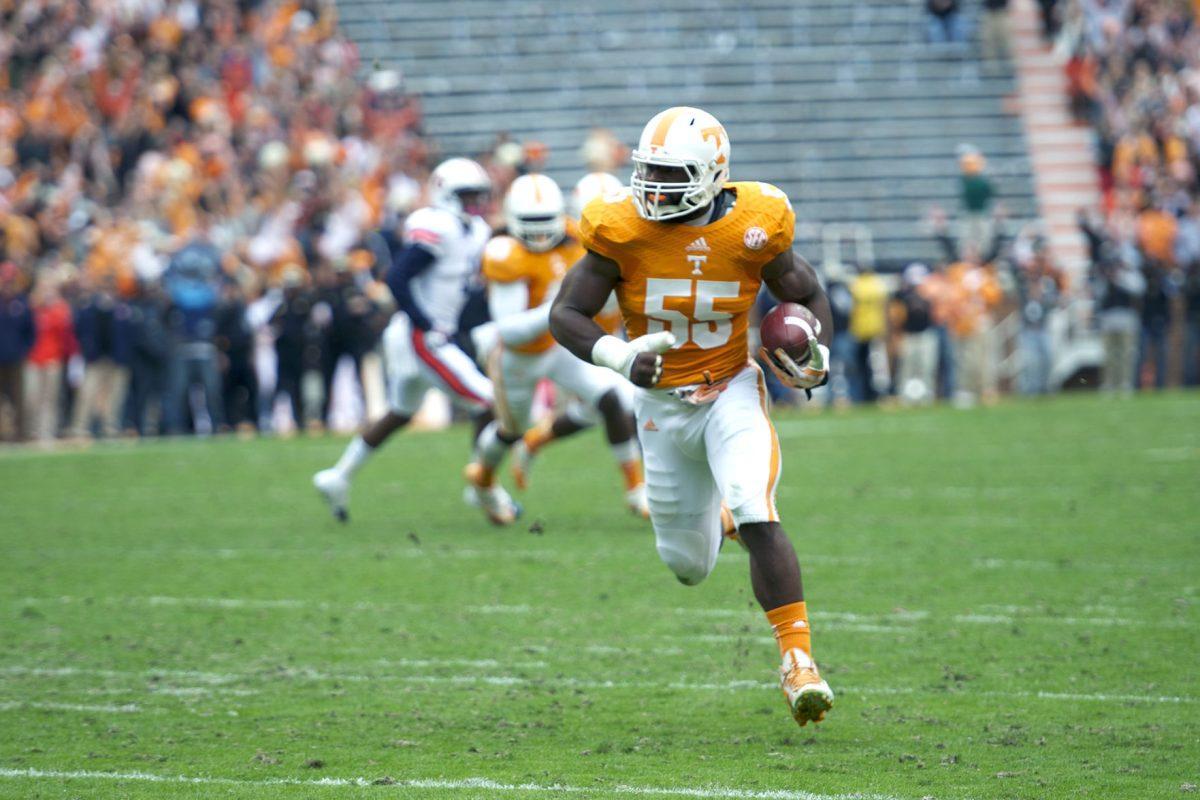 Tennessee senior defensive end Jacques Smith runs into the end zone after intercepting Auburn quarterback Nick Marshall's pass during the second quarter at Neyland Stadium on Saturday. Smith returned the pick 18 yards for a touchdown.