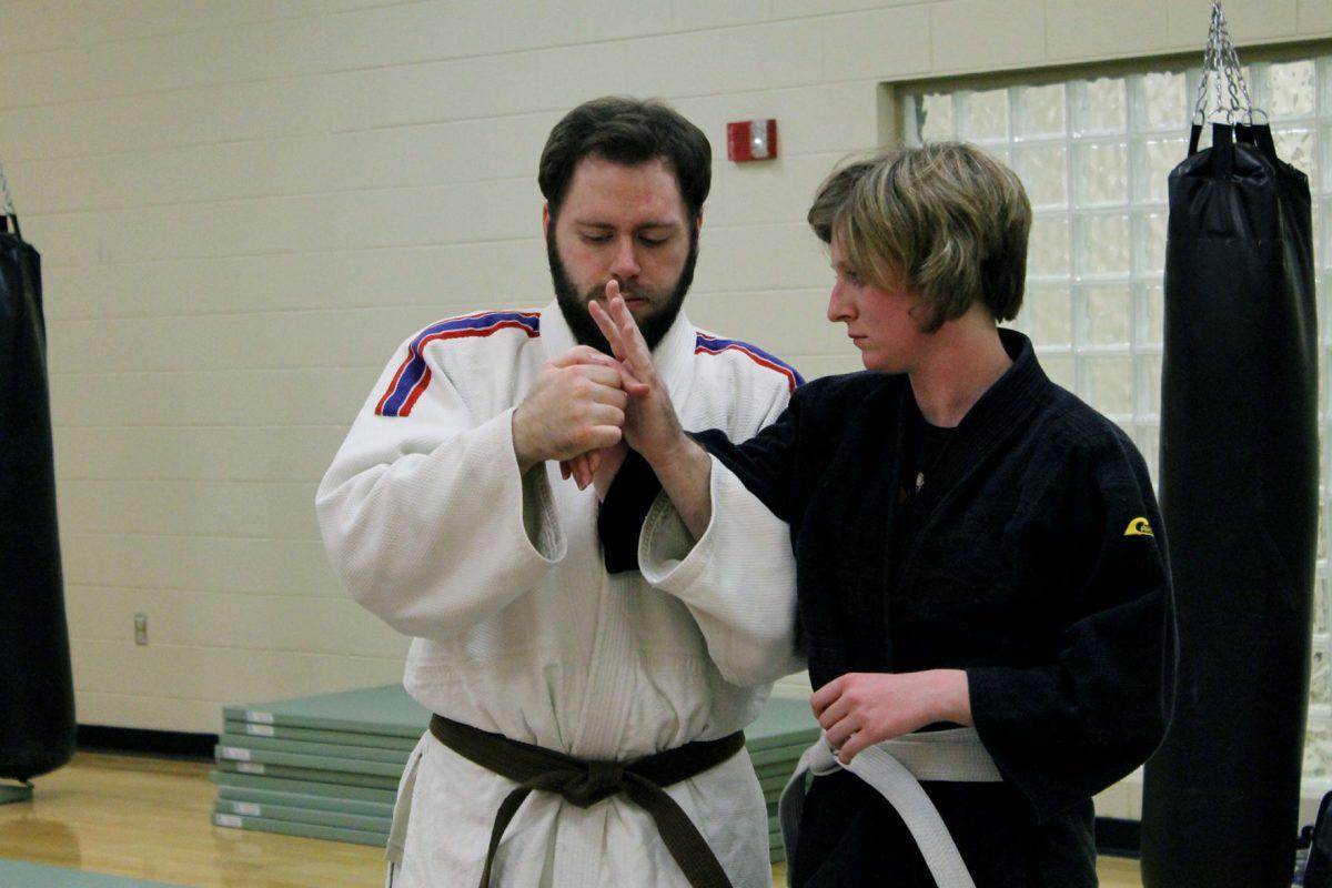 Josh Elliott, left, and Sarah Beck practice jiu-jitsu inside the TRECS center on Nov. 11.