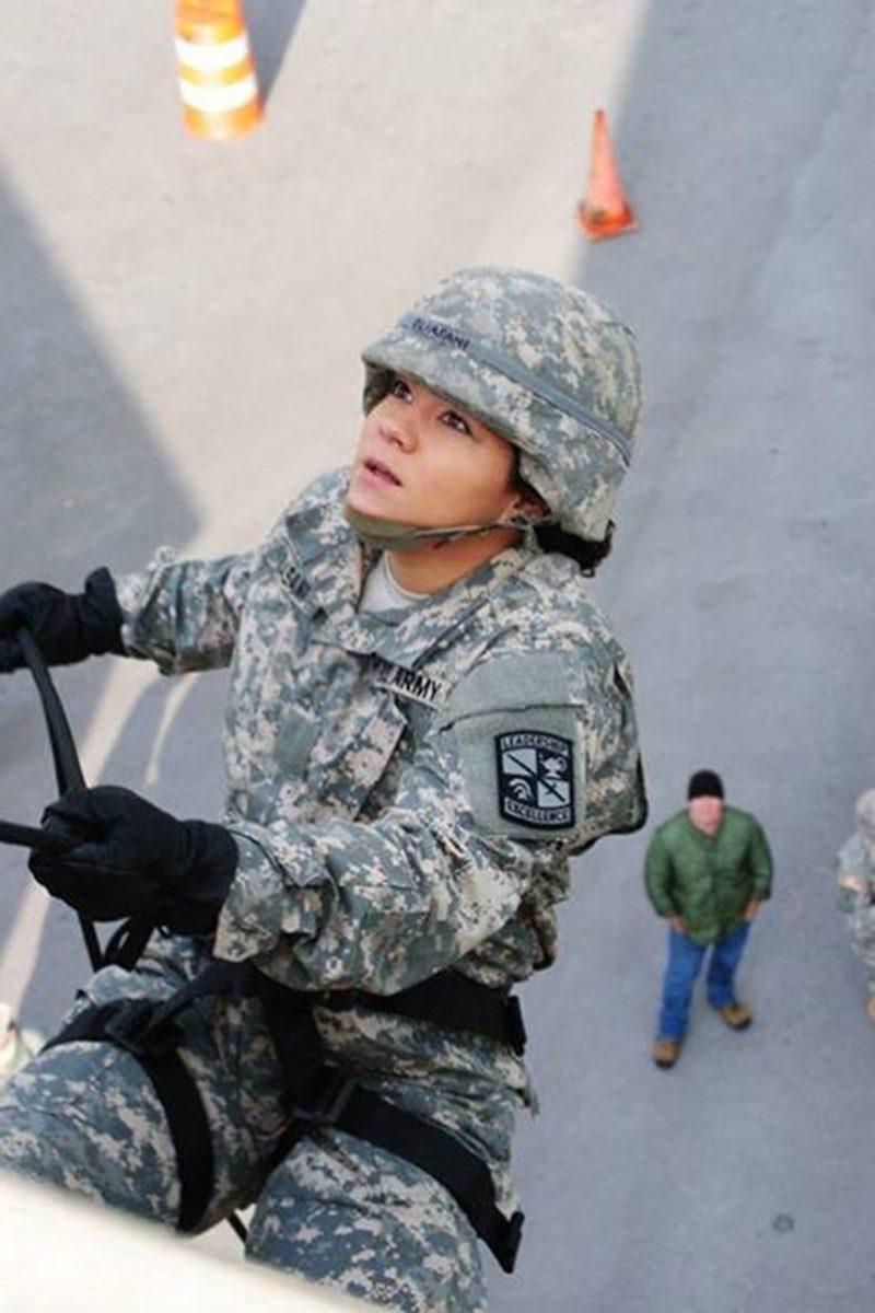 Cadet Olivia Oliasani repels down a wall during a ROTC training activity in September 2013.
