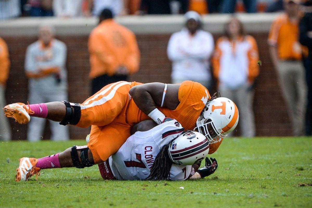 Tennessee junior offensive tackle Antonio "Tiny" Richardson pancakes South Carolina defensive end Jadaveon Clowney during UT's 23-21 win over the Gamecocks at Neyalnd Stadium on Oct. 19.