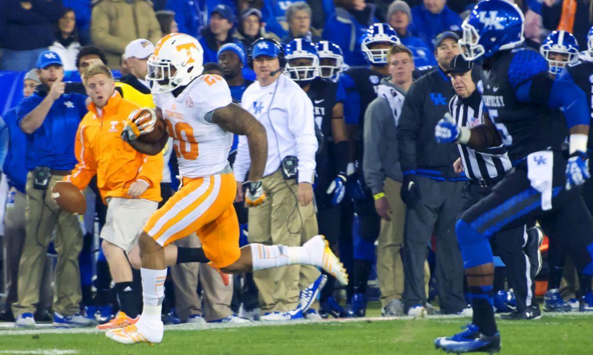 Tennessee senior running back Rajion Neal sprints down the Kentucky sideline for a 60-yard touchdown run during the Vols' 27-14 win against the Wildcats at Commonwealth Stadium on Saturday. On the rush, Neal eclipsed the 1,000-yard mark on the season. He finished the day with 134 yards on 20 carries.