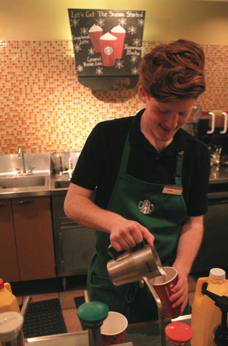 Tyler Harwell, barista at Hodges' Starbucks, prepares a latte on Dec. 2.