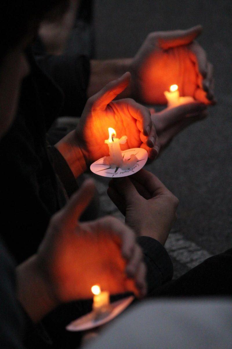 Students light a candle for the "Light a Candle for Peace" vigil in memory of lives lost in the ongoing war between Gaza and Israel on Dec. 5, 2012 – an event the Hillel Jewish student organization co-sponsored with the MESA's ACtion group for Gaza. UT's Hillel/Jewish Student Organization is partnering with the Muslim Student Association to host an open forum discussing the topic on Tuesday at the Melrose Courtyard beginning at 8 p.m.
