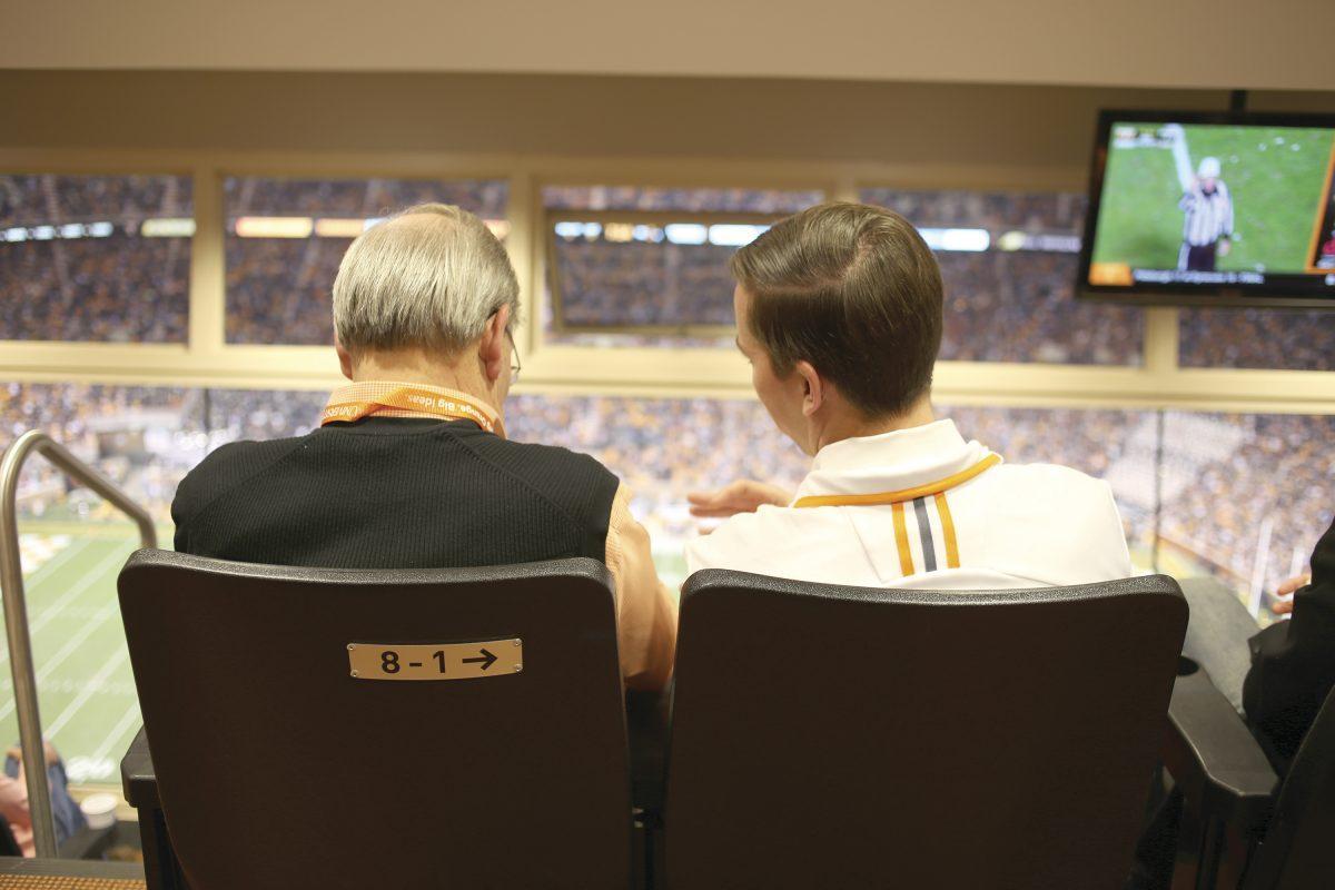 Jimmy Cheek watches the Nov. 23 Tennessee game against Vanderbilt at Neyland Stadium next to his son Jeff, a local auto-repair shop owner. Chancellor since 2009, Cheek has so far defined his position as raising UT's standing toward becoming a Top 25 public university.