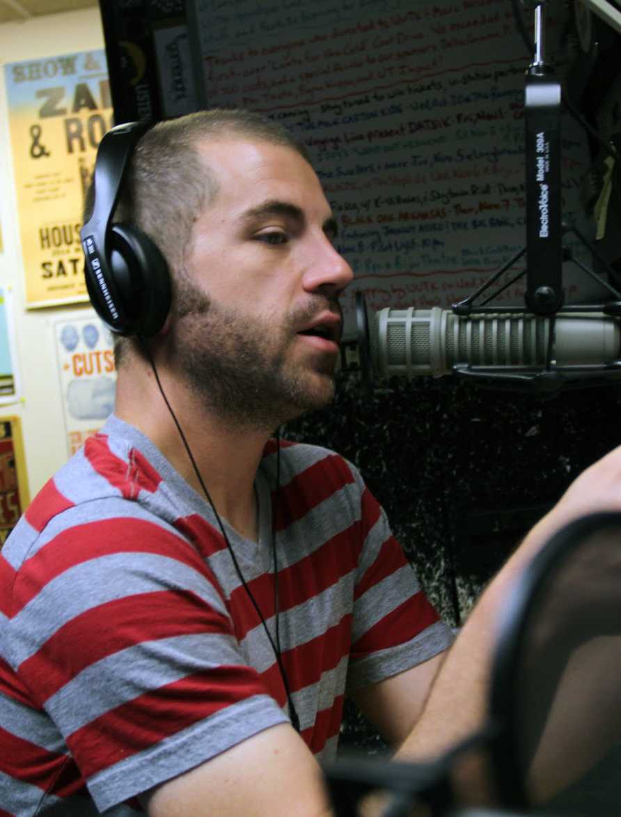 Matt Moon, a senior in journalism and electronic media, covers a morning shfit at 90.3 The rock as a part of his practicum.