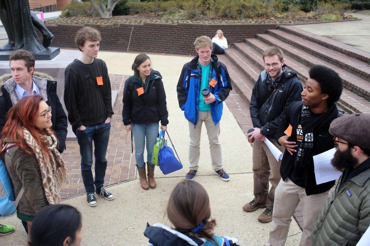 David Hayes discusses with the group the actions that will take place with the march to CFO Charles M. Peccolo's office on Thursday.