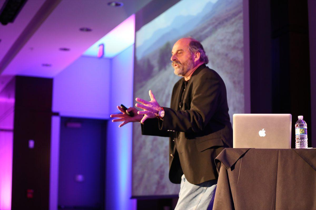 Giving a talk called "Crafting a Soil Conservation Legacy," Neal Eash, Ph.D. and professor in the department of biosystems engineering and soil science speaks to a full audience in the Toyota Auditorium on Saturday, Feb. 22.