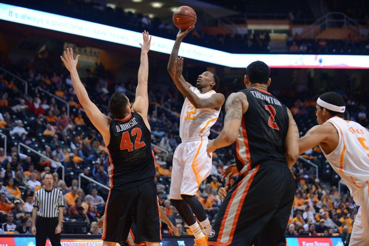 Tennessee senior guard Jordan McRae shoots over Georgia forward Nemanja Djurisic (42) in the Vols' 67-48 win over the Bulldogs at Thompson-Boling Arena on Feb. 18.