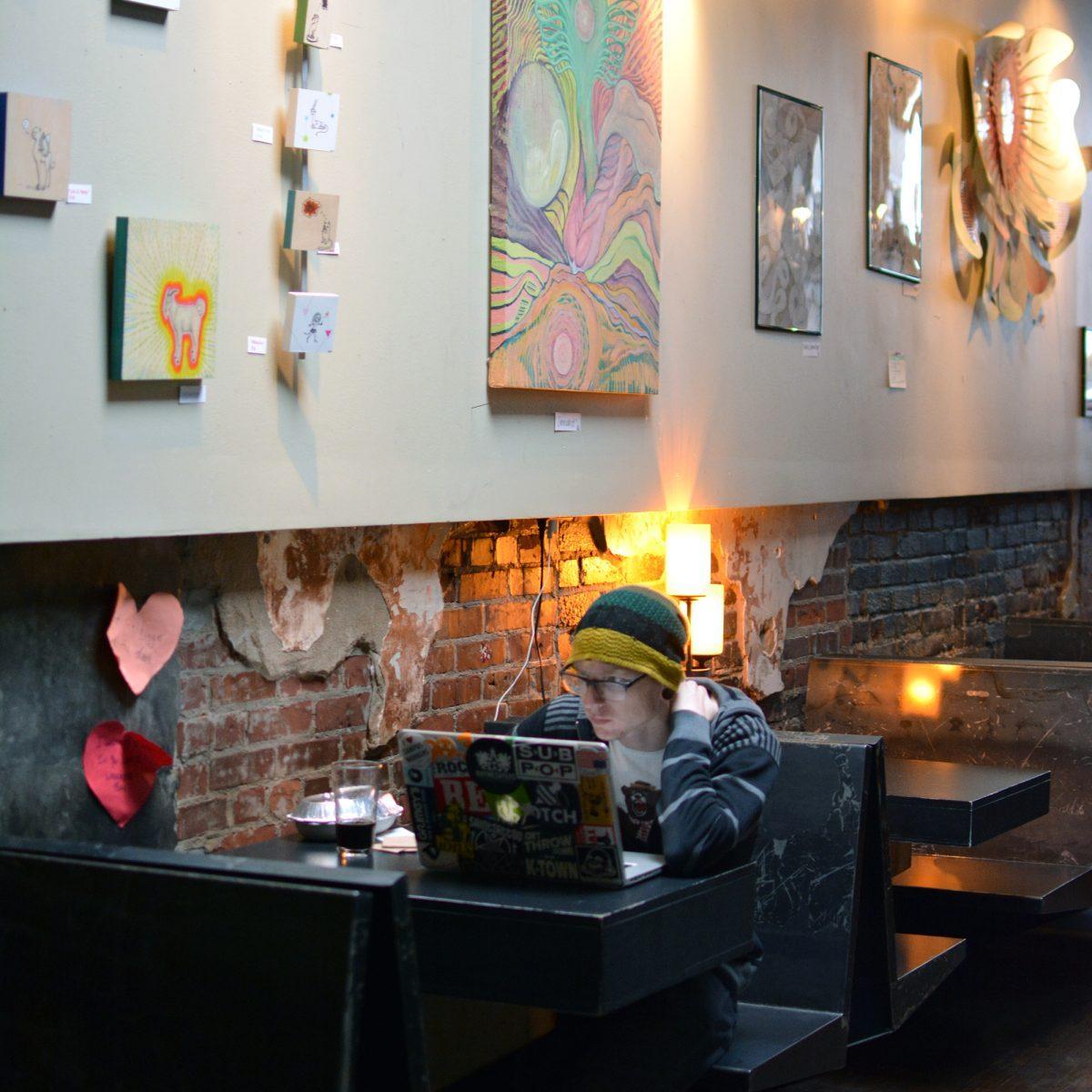 Dan Hood, a junior in art, spends his time in at the Fort Sanders Yacht Club in between classes to unwind and catch up on school work on Monday. "I've been coming to the Yacht Club for a couple of years," Hood said, "and it's been great."
