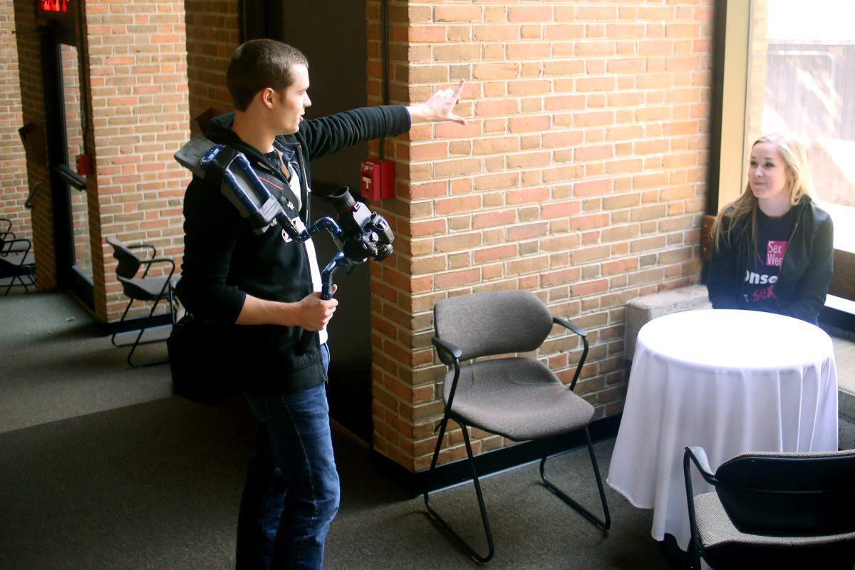 Matt Miller, a junior in theater and an independent filmmaker, directs actress Paige Woodward for a short skit in the Clarence Brown Theatre on Feb. 25.