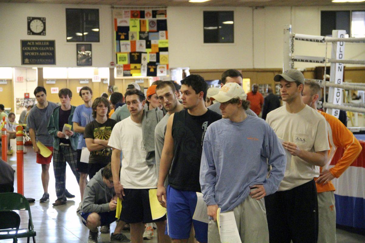 After weigh-ins on Sunday, Golden Gloves Gym management hold a mandatory meeting for boxers participating in the upcoming Ace Miller Memorial Boxing Tournament. The majority of the boxers in the photo raised their hands to signify they have no prior experience in the ring.