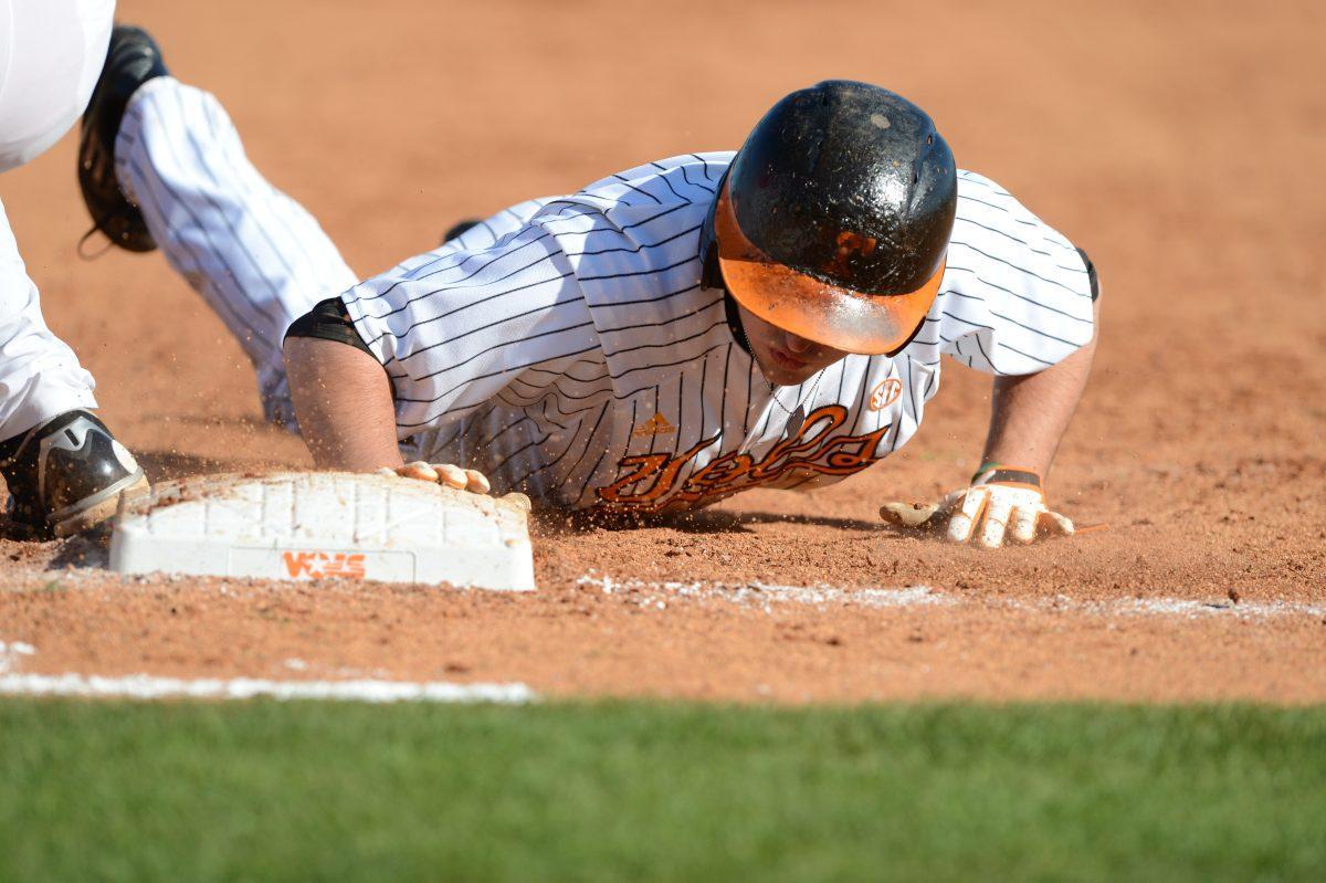 Junior Will Maddox slides into first during game two in the baseball series against the Ole Miss Rebels at Lindsey Nelson Stadium on April 20, 2013. Maddox and the Vols will open the 2014 season this weekend against Purdue on Saturday at 3 p.m.