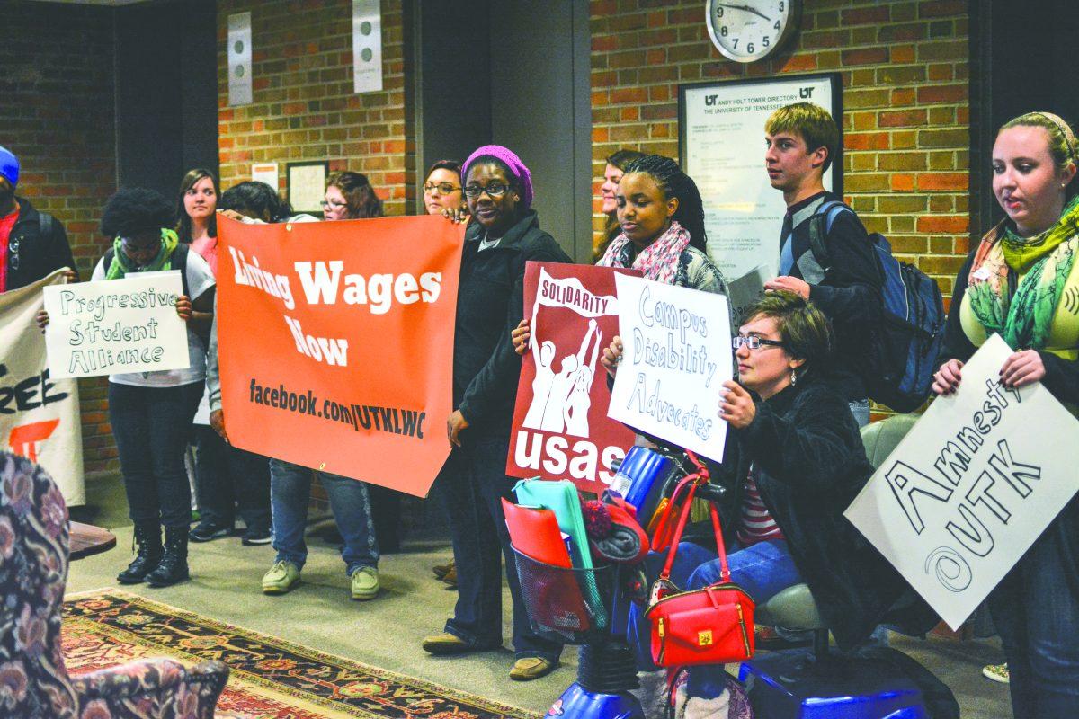 More than 15 student groups in the Living Wage Coalition, including the Roosevelt Institute and Campus Disability Advocates, deliver a letter advocating the increase of wages for UT workers to Chancellor Jimmy Cheek's office in Andy Holt Tower on Wednesday.