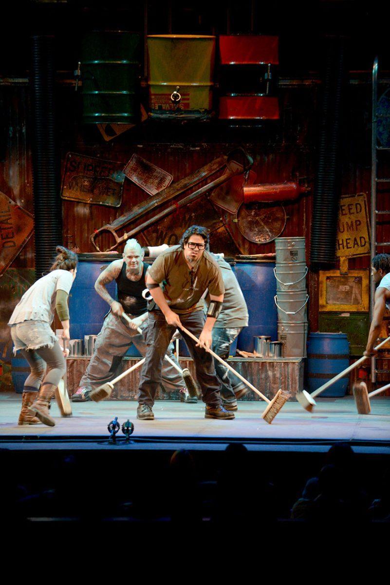Andrew Pang, center, sweeps with a comical expression during STOMP's opener at the Tennessee Theatre on Friday.