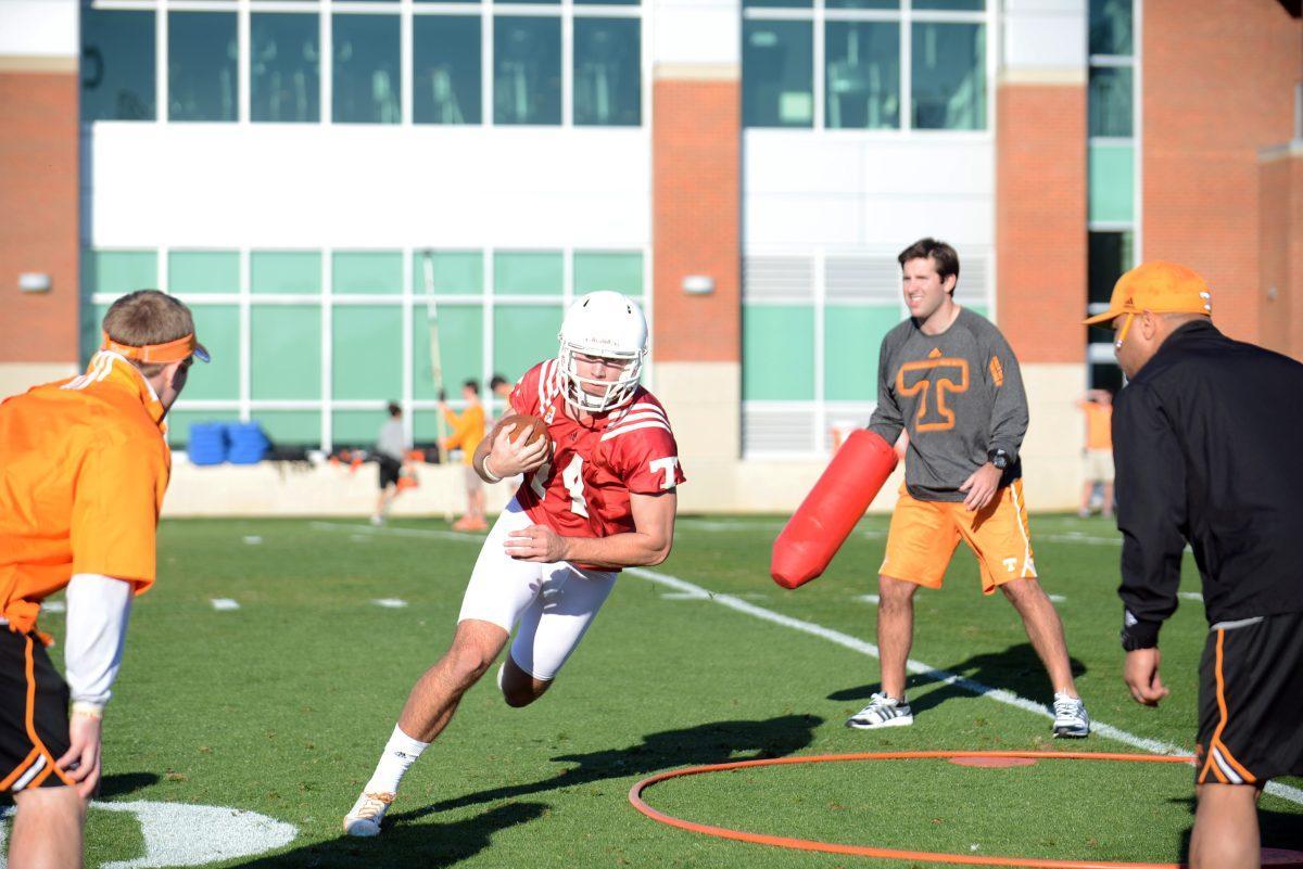 Tennessee senior quarterback Justin Worley runs drills during UT's first spring football practice on Friday at Haslam Field.
