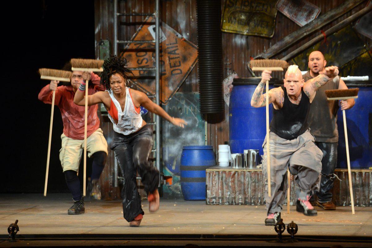 Cammie Griffin, left, and John Sawicki, right, dance with intensity during STOMP's performance on Friday at the Tennessee Theatre.