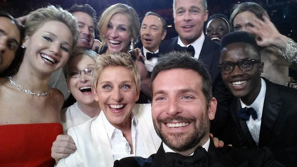 Oscars host Ellen DeGeneres poses for a selfie during the Academy Awards on Sunday with stars Bradley Cooper, Jennifer Lawrence, Angelina Jolie and others in a photo that generated a record-breaking number of retweets – 3 million and counting as of Monday night – on Twitter.