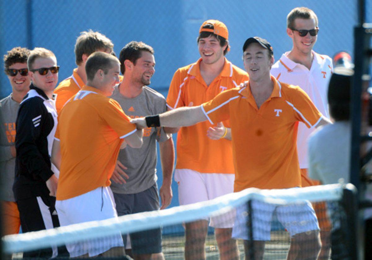Senior Jarry Chaplin, front right, celebrates with teammates after clinching UT's 4-3 win over Mississippi State at Barksdale Stadium on Sunday.