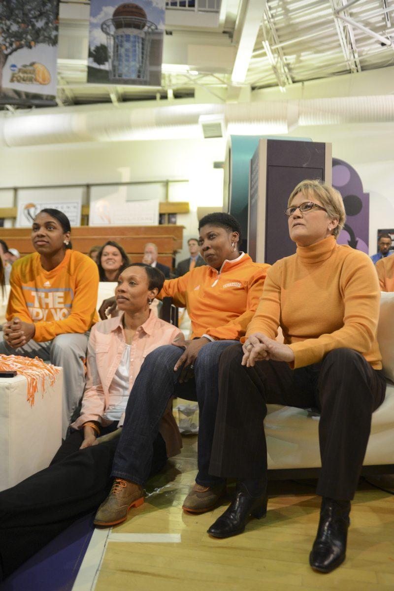 Tennessee head coach Holly Warlick, far right, assistant coach Kyra Elzy, mid-left, and assistant coach Jolette Law, mid-right, and junior point guard Ariel Massengale, far left watch eagerly as they annouce the seeding for the NCAA Tournament during Selection Monday in the Women's Basketball Hall of Fame.