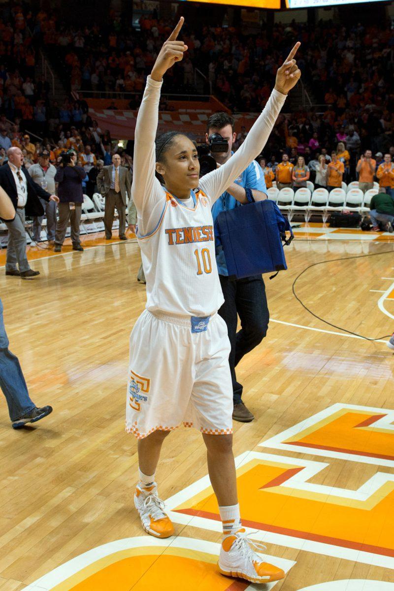 Senior guard Meighan Simmons salutes the Thompson-Boling Arena crowd during the Senior Day ceremony before UT's game against South Carolina on Sunday. The Vols beat the Gamecocks, 71-63.