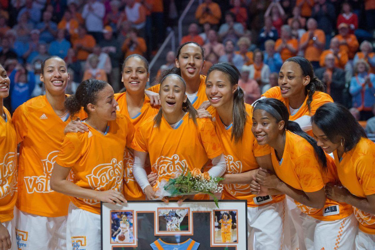 Senior Meighan Simmons, center, grins with her teammates during the Senior Day Presentation before UT's game against the No. 4 South Carolina Gamecocks at Thompson-Boling Arena on Sunday. The Vols beat the Gamecocks, 71-63.