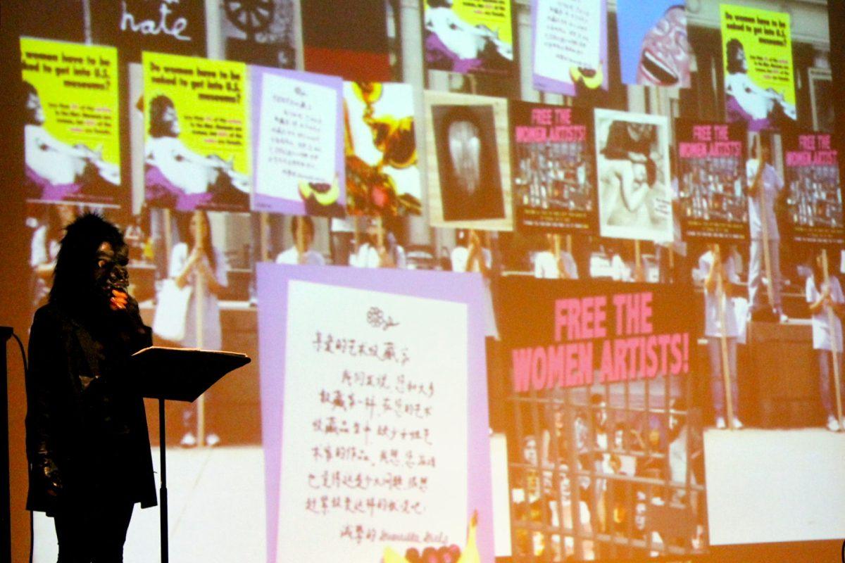 Käthe Kollwitz, representing the German artist, speaks about the Guerrila Girl movement in the UC Auditorium on Thursday night.
