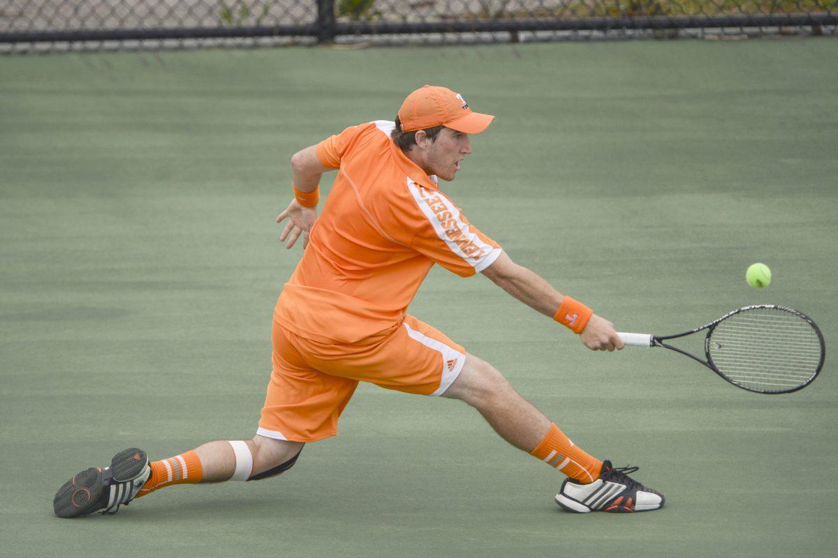 Junior Hunter Reese slides to hit a return during a match against Auburn at Barksdale Stadium on April 14, 2013. UT will play No. 29 Auburn on Friday and then will head to No. 33 Alabama on Sunday.