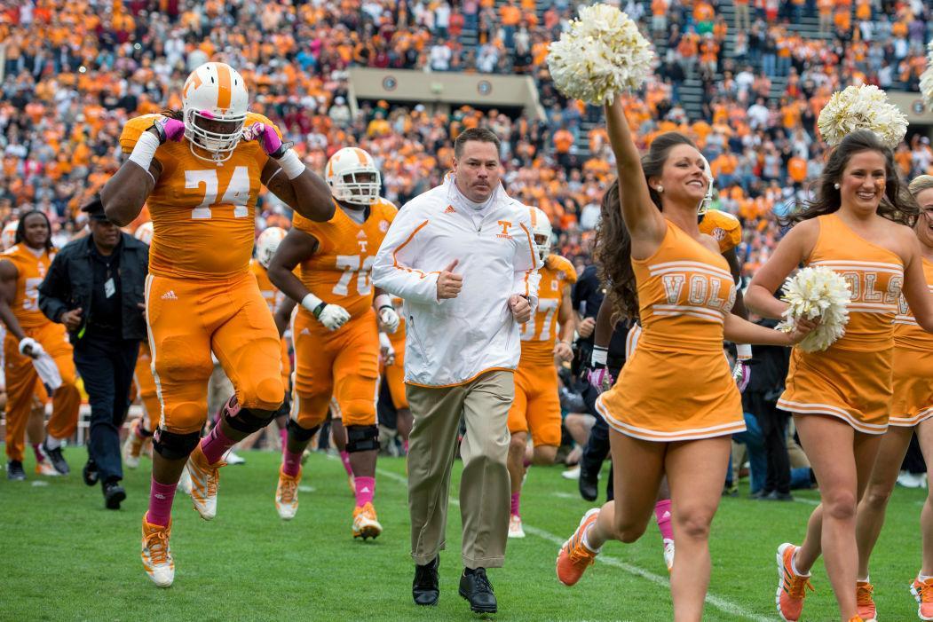 Tennessee head coach Butch Jones runs out of the "T" prior to the Vols' 23-21 victory over the South Gamecocks on Oct. 19, 2013 in Neyland Stadium.