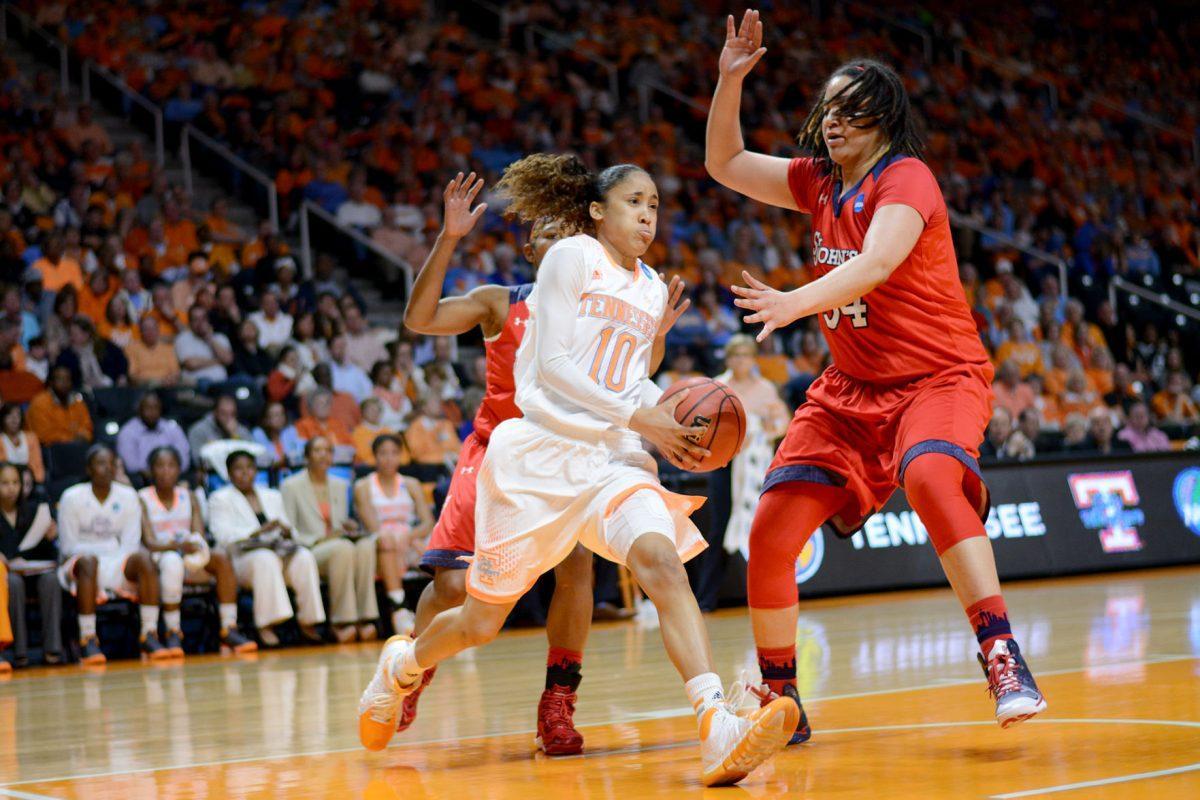 Former Lady Vol Meighan Simmons drives to the basket in the Lady Vols' 67-51 victory over St. John's in the Round of 32 of the NCAA tournament in Thompson-Boling Arena on March 24. Simmons was selected 26th overall by New York Liberty in the third round of the 2014 WNBA Draft on Monday.
