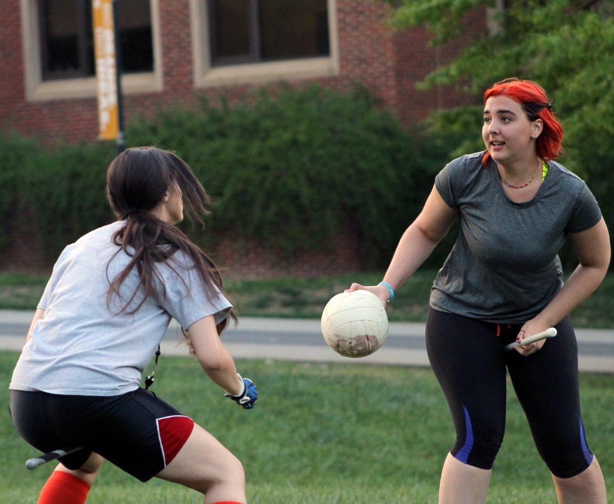 Kelsey Walton, right, a senior in linguistics and beater for the Time Turners, dodges Quidditch team captain Karissa Kirsch during practice in the HSS amphitheater on Monday.