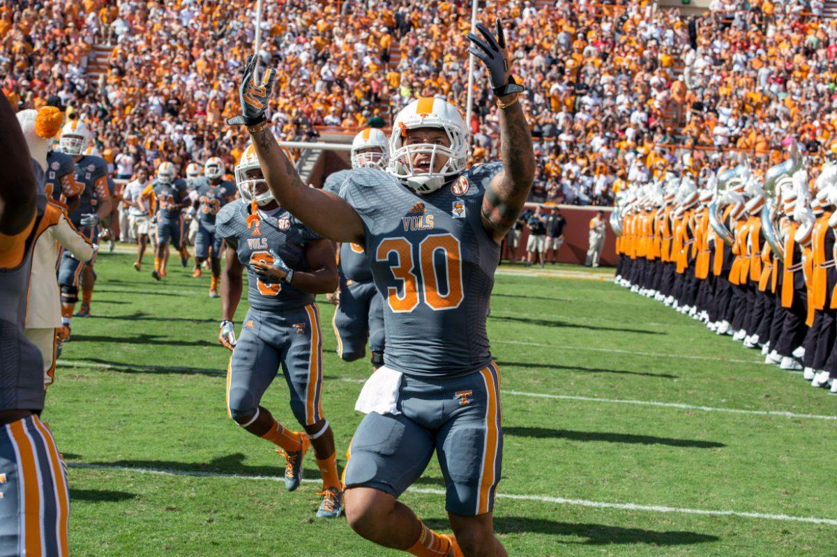 Former Tennessee running back Alden Hill runs through the 'T' during the Vols' game against Georgia on Oct. 5 2013, at Neyland Stadium. On Tuesday, Hill announced via Instagram that he is transferring from UT.