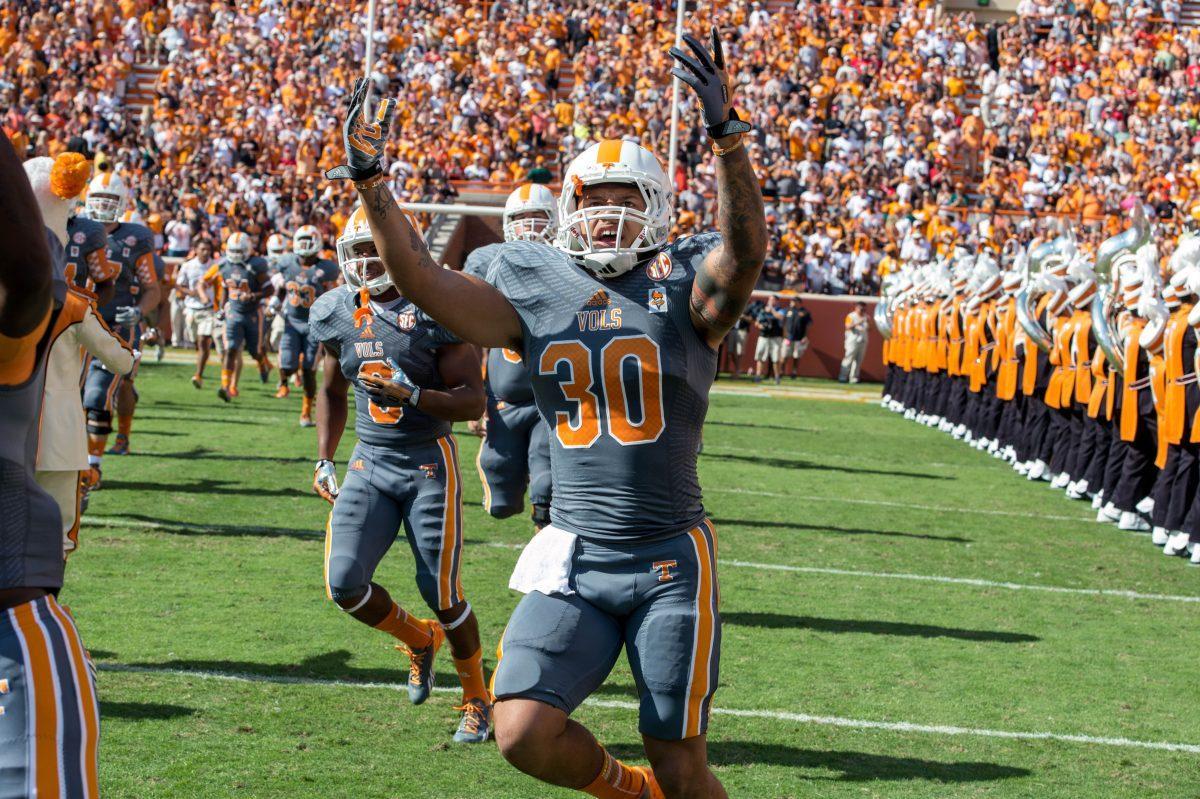 Former Tennessee running back Alden Hill runs through the 'T' during the Vols' game against Georgia on Oct. 5 2013, at Neyland Stadium. On Tuesday, Hill announced via Instagram that he is transferring from UT.