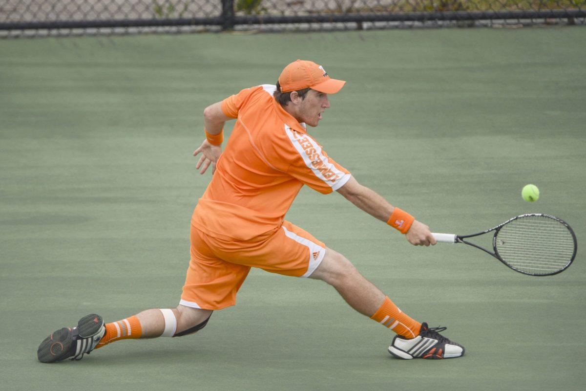 Junior Hunter Reese slides to hit a return during a match against Auburn at Barksdale Stadium on April 14, 2013. UT will play No. 29 Auburn on Friday and then will head to No. 33 Alabama on Sunday.