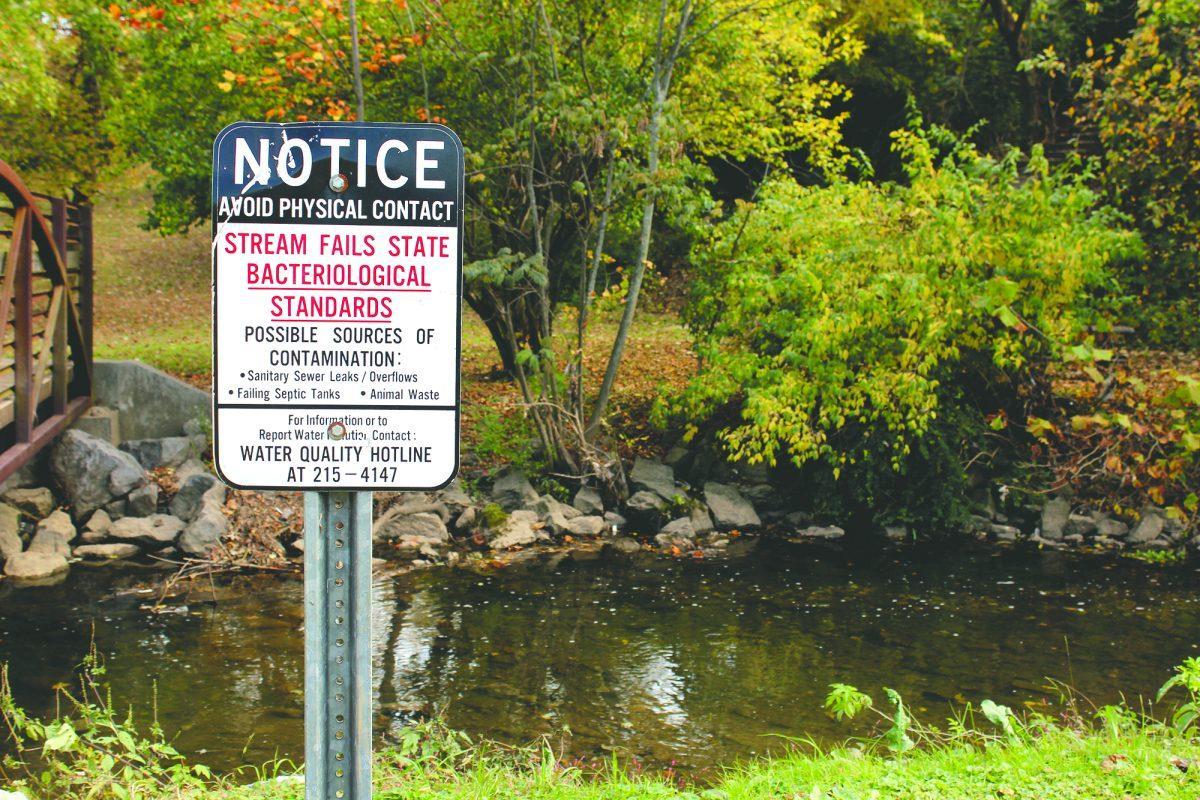 A sign warns visitors of the water quality in the Tyson McGhee River behind The Tower at Morgan Hills apartments.